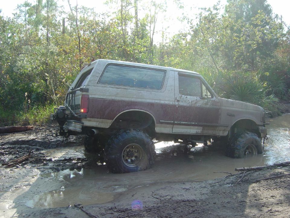 1993 Ford Bronco stuck in mud, lifted suspension, off-road tires