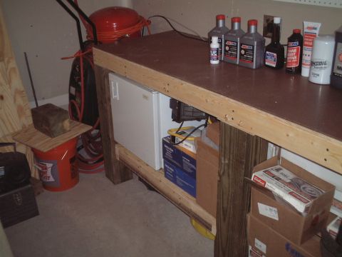 1967 Ford Galaxie - Beer fridge. :) Oil pans for oil changes live underneath the shelf on the floor.