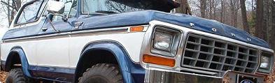 1978 Ford Bronco - Front 3/4 view of a 1978 Ford Bronco, its distinctive grille and two-tone paint scheme.