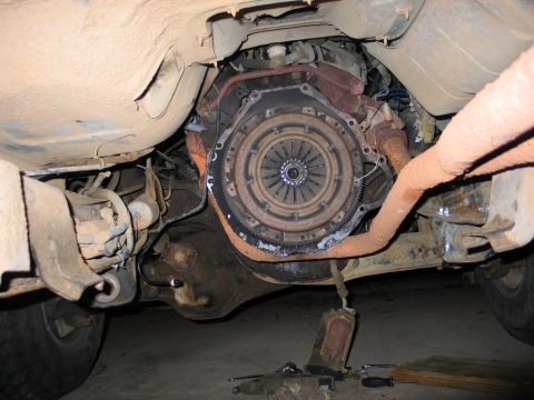 1989 Ford F-150 - Close-up of the vehicle's clutch assembly and drivetrain components, showing wear and tear.