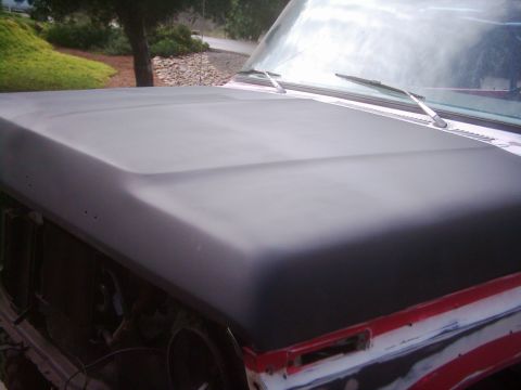1978 Ford Bronco - Hood and windshield of a 1978 Ford Bronco undergoing painting.