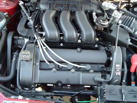 2001 Ford Taurus - Close-up of a Duratec V6 engine, showing the intake manifold and valve covers.