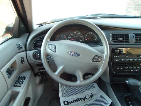 2001 Ford Taurus - The interior of a 2001 Ford Taurus, the dashboard, steering wheel, and center console.