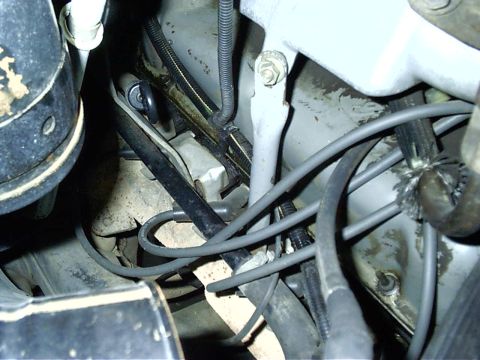 1987 Ford Bronco - Close-up view of engine bay components, including wires and metal parts, with a watermark at the bottom right.