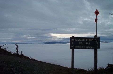 1995 Ford Bronco - Signpost at Manastash Ridge, indicating the direction to Quartz Mtn. Viewpoint, above a thick layer of clouds.