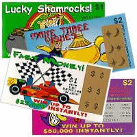 1991 Ford Bronco - Various scratch-off lottery tickets with different themes and prize amounts are piled together.