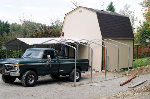 1996 Ford Bronco - Hubby using the '77 for a ladder
