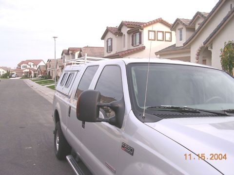 2004 Ford F-250 - A silver Ford F-250 truck is parked on a street in front of houses, with a date stamp of 11.15.2004 visible.