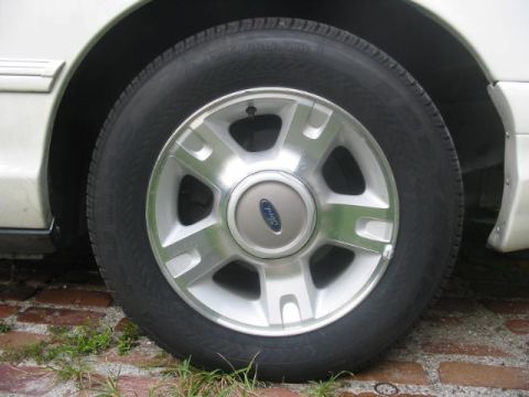 1997 Ford Crown Victoria - Close-up of a 1997 Ford Crown Victoria wheel and tire.
