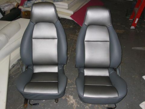 1997 Ford Crown Victoria - Pair of car seats with two-tone upholstery shown indoors.