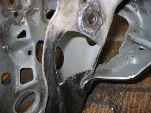 1987 Ford Thunderbird - hole needed to clear front lower control arms to move them up 3/4"