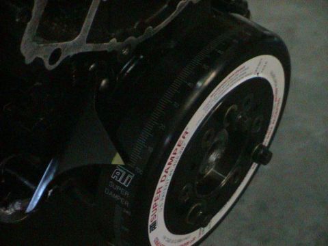 1979 Ford Bronco - Close-up of an ATI Super Damper, an engine component, with visible text and measurement markings.