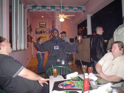 1996 Ford Probe - A group of people are enjoying drinks and conversation at tables in a restaurant.