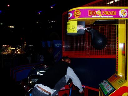 1996 Ford Probe - A person plays a "Boo Punch" arcade game at an amusement center.
