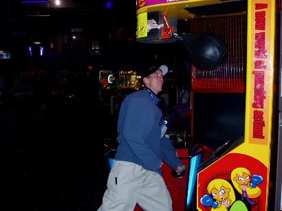 1996 Ford Probe - Arcade game with a punching bag is being played by a man.