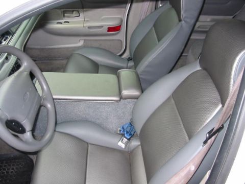 1997 Ford Crown Victoria - The interior of a 1997 Ford Crown Victoria features two-tone gray leather seats and a gray center console.