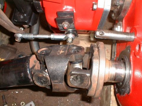 1990 Ford Bronco - This image shows a close-up view of a vehicle's drivetrain components, including a driveshaft and linkage.
