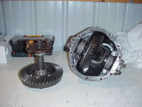 1989 Ford Bronco - Differential gears and housing components are displayed on a surface, with a toolbox in the background.