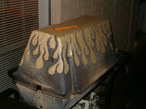1996 Ford Bronco - This custom painted car part features flame graphics and a pencil resting on its surface.