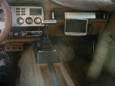 1978 Ford Mustang II - Interior view of a car, a dashboard with gauges and an aftermarket screen.