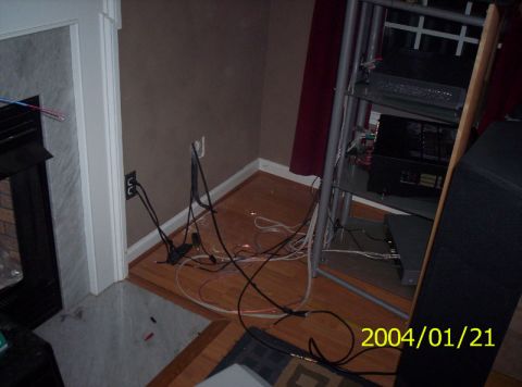 1986 Ford Bronco - A cluttered room with electrical wiring and audio equipment is visible.