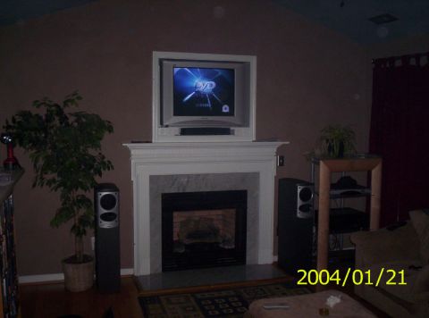 1986 Ford Bronco - Interior scene of a living room a fireplace, TV, and audio equipment, dated 2004/01/21.