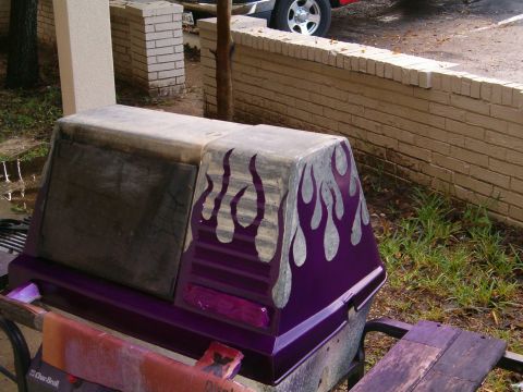 1996 Ford Bronco - A custom-painted cooler with flame graphics sits outdoors, with a vehicle partially visible in the background.