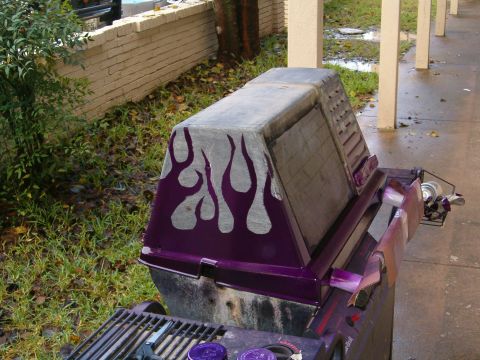 1996 Ford Bronco - This grill has been customized with purple flames painted on its side.