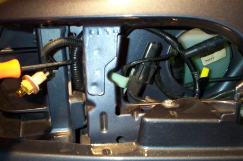1998 Ford Crown Victoria - Here's a pic of the wire routing, viewed from the side. A screwdriver points to the new wire and it's loom. You can also see the cut and se…