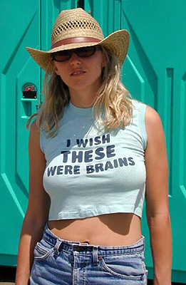 2003 Jeep TJ - Woman in a straw hat and a t-shirt with a humorous slogan stands in front of a teal structure.