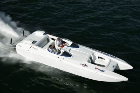 1991 Ford Bronco - A white performance boat cuts through the water, leaving a wake behind it.