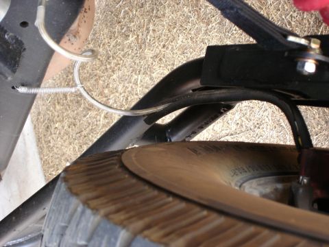 1987 Ford Bronco - Detail shot of a spare tire and suspension system components.