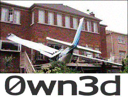 1985 Ford Bronco - Small airplane crashed into the side of a brick house, wings bent.