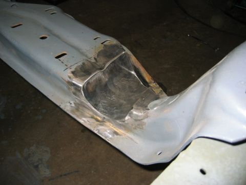 1978 Ford Bronco - A close-up view of a gray metal vehicle frame section shows evidence of repair work.