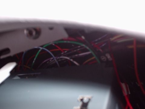 1998 Ford Taurus - A close-up view of a complex vehicle wiring harness, showing many colored wires.