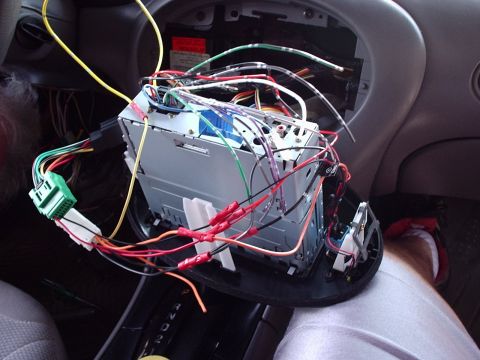 1998 Ford Taurus - Aftermarket car stereo installation with a complex wiring harness.