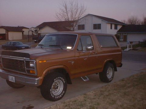 1981 Ford Bronco - This Ford Bronco is parked in front of a suburban house during twilight.