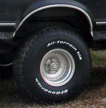 1988 Ford Bronco - Close-up of the rear wheel and fender of a 1988 Ford Bronco.
