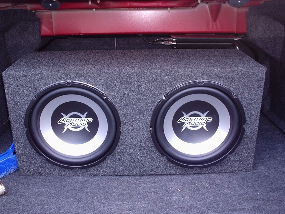 dual subwoofers in a car trunk