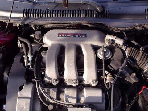 1998 Ford Taurus - Close-up view of a Duratec 24 Valve V6 engine's intake manifold and surrounding components.