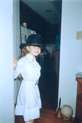 1991 Ford Bronco - A young girl dressed as a cowboy smiles while standing in a doorway.