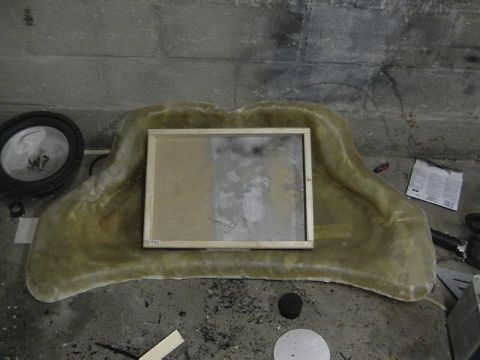 1999 Ford Taurus - A custom fiberglass mold is shown with a wooden frame, sitting on a workshop floor.