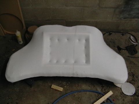 1999 Ford Taurus - A white foam car part is shown, possibly a custom interior component or mold, with a rectangular recessed area.