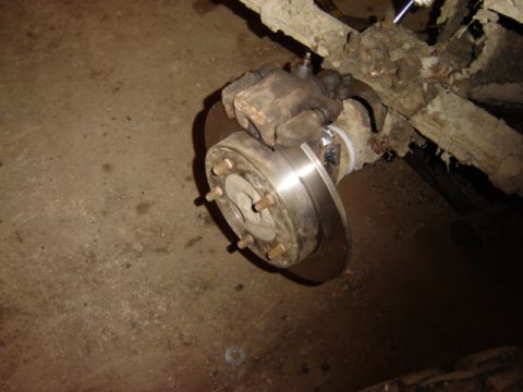 1992 Ford Bronco - Close-up of a vehicle's brake rotor and caliper assembly, showing mechanical components.