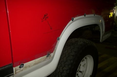 1981 Ford Bronco - This vehicle is undergoing body repair, with visible rust damage and new fender flare attachments.