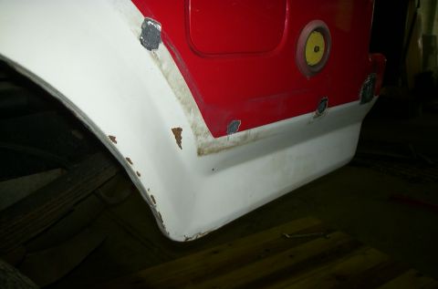 1981 Ford Bronco - Vehicle's rear fender and body panel, showing signs of rust and recent bodywork.