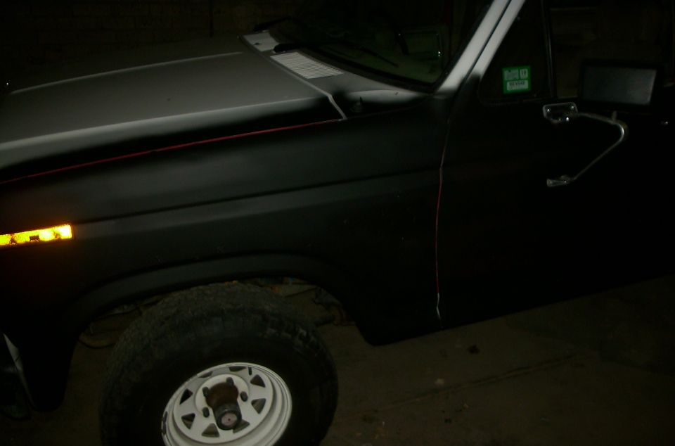 Ford Bronco front fender and door, matte black paint, white rim wheel