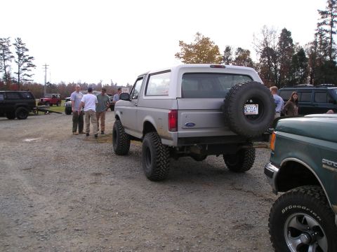 1996 Ford Bronco - Silver 1996 Ford Bronco parked outdoors with a group of people nearby.