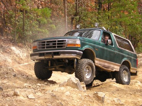 1996 Ford Bronco - This 1996 Ford Bronco navigates a challenging rocky terrain on an off-road trail.