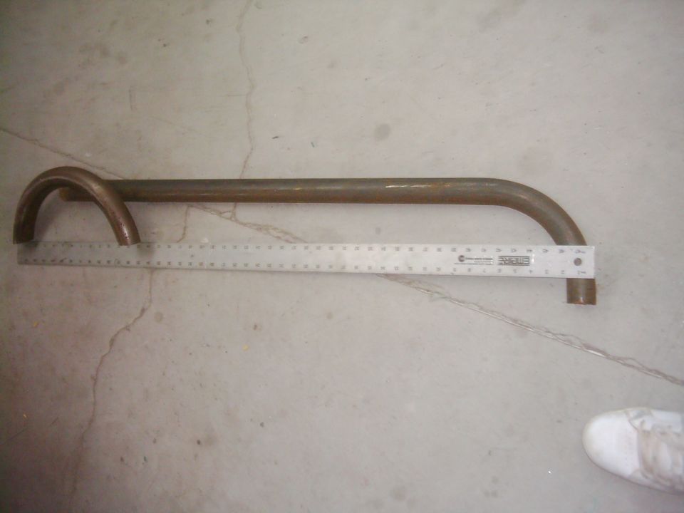 metal tube with ruler next to it